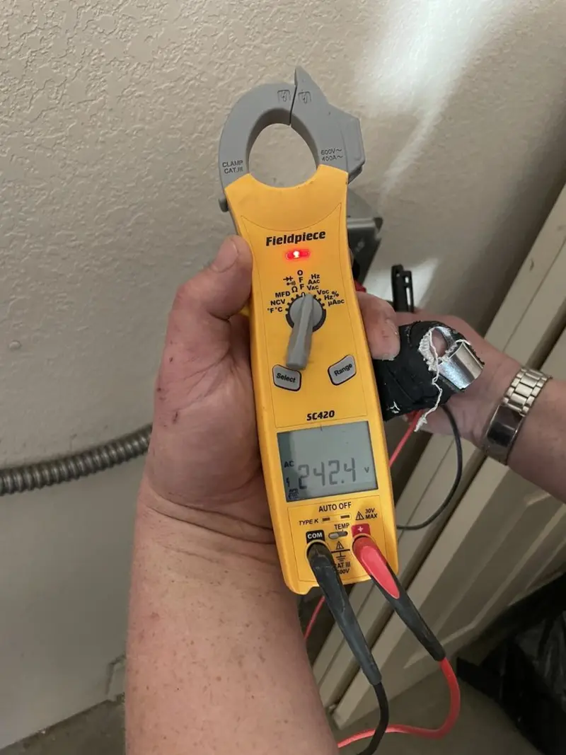 Voltage testing with clamp meter during Ceiling Fan Installation in Endicott